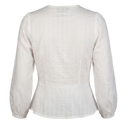 Blusa blanca con escote en V y textura de puntos suizos